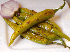 Fodni Mirchi which is actually tempered green chillies originates from the Maharashtrian cuisine and acts as a amusing accompaniment to any curry, rice, chapatti, bhakri.